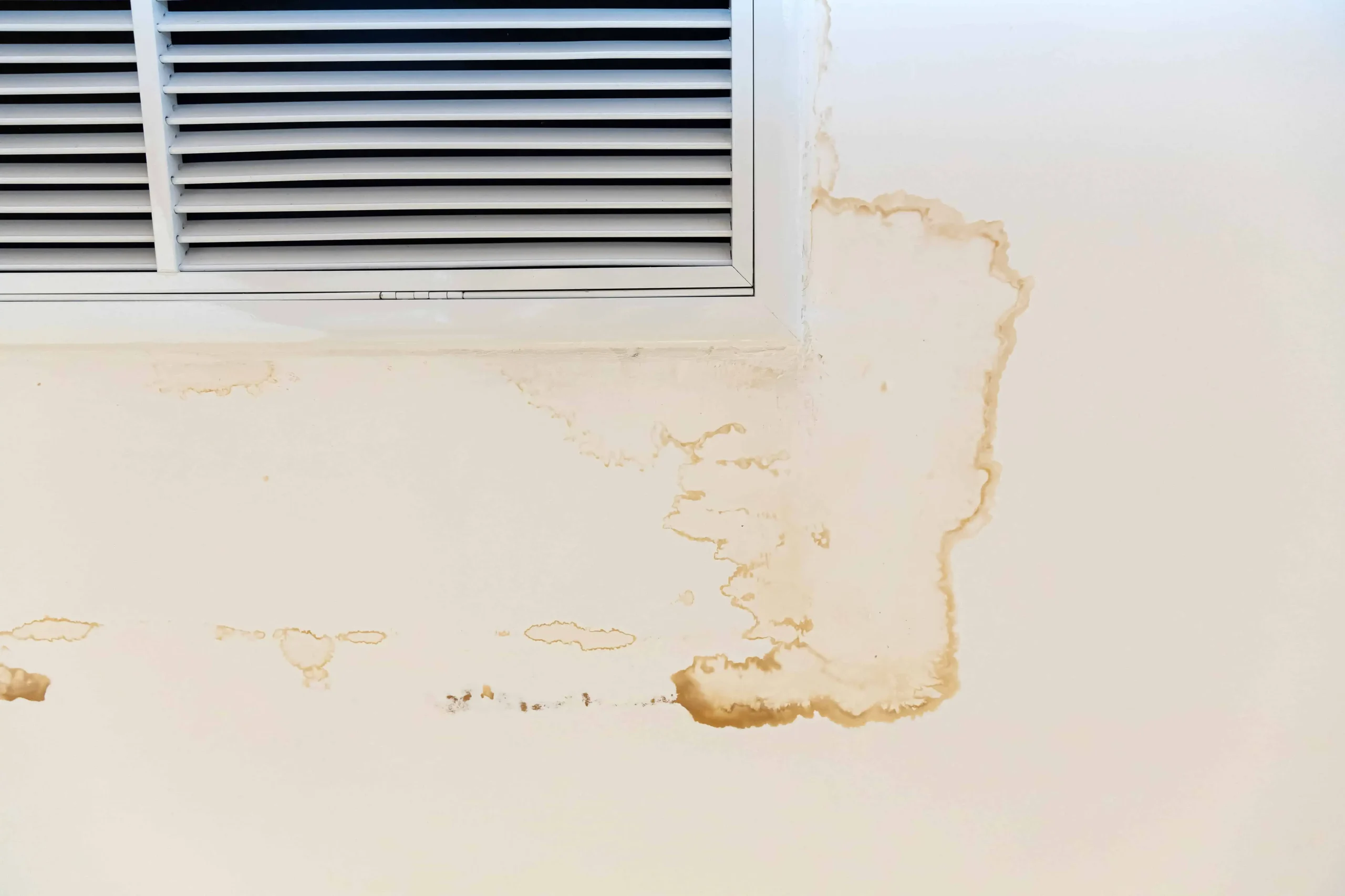 Ceiling stain and cracked and mold after air conditioner has water drop leak on air grille.